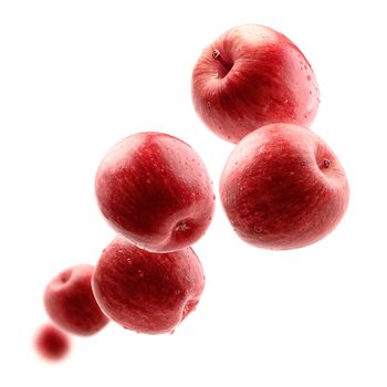 Red apples levitate on a white background.