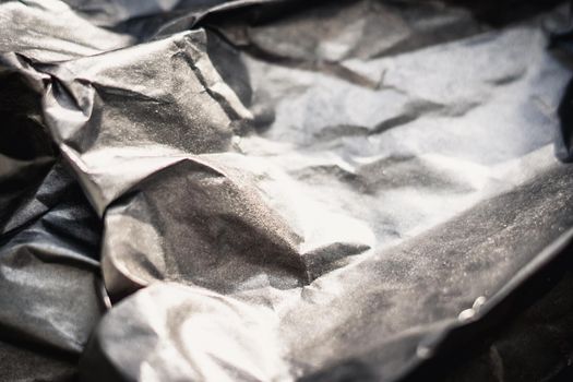 Abstract real paper surface background. Aluminum Platinum Silver foil. Wrinkled crumpled folds bend crush crease kink. Crystal, polygonal texture wave futurism 80s retro style new year. Brown tone.