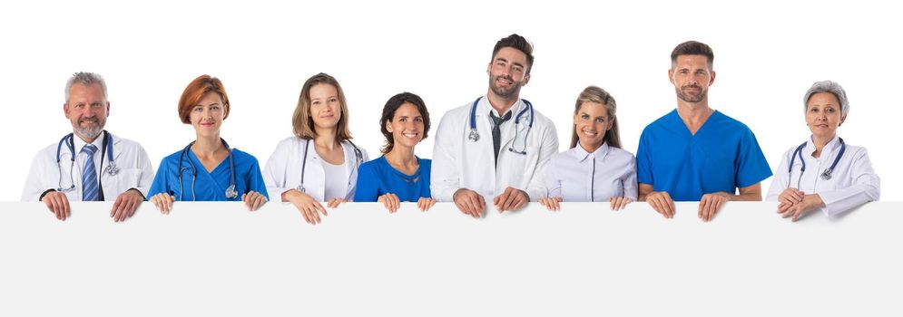 Medical doctors team holding blank billboard isolated on white background, copy space for text content