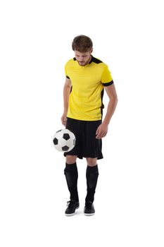 Full length portrait of a soccer player with ball isolated on white background