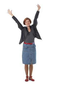 Full body shoot of happy redhead woman with arms raised, isolated on white background