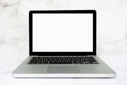Laptop or notebook with blank screen on white table. Business concept. Copy space.