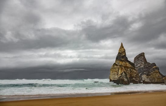 Praia da Ursa beach, dark stormy clouds