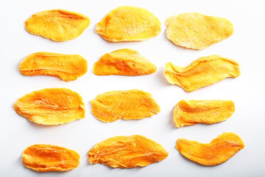 Orange Slices of Dried Sugar Mango Isolated on White Background