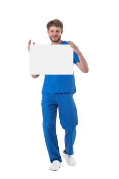 Male nurse posing with blank empty paper isolated on white background