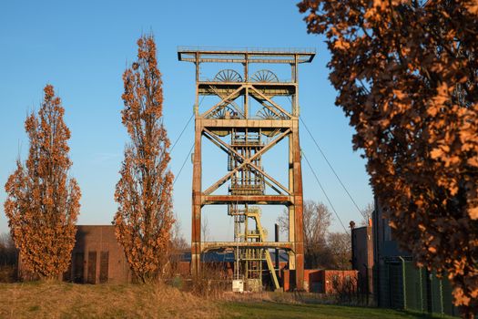Headframe of old cold mine against sky, industrial heritage of Ruhr Metropolis, Dortmund, Germany