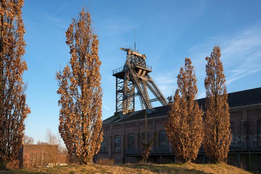Headframe of old cold mine against sky, industrial heritage of Ruhr Metropolis, Dortmund, Germany