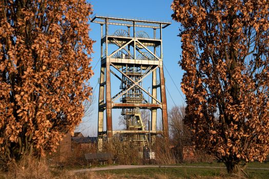 Headframe of old cold mine against sky, industrial heritage of Ruhr Metropolis, Dortmund, Germany