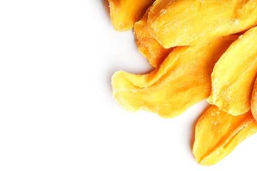 Ripe dried mango sliced on a white background with free space