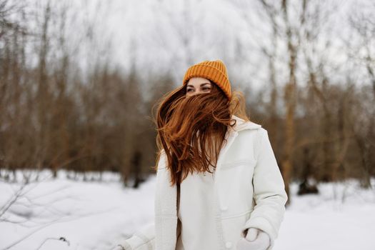 portrait of a woman red hair walk in the fresh winter air winter holidays. High quality photo
