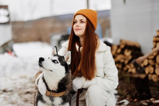 woman with a purebred dog outdoor games snow fun travel Lifestyle. High quality photo
