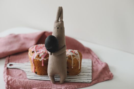 Easter cake, colorful eggs and rabbit toy. Happy Easter holiday concept. festive spring season.