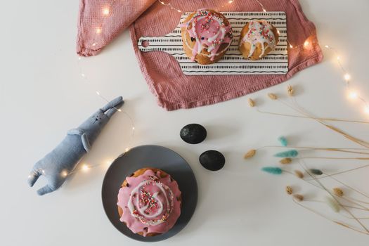 Easter cake, colorful eggs and rabbit toy. Happy Easter holiday concept. festive spring season.