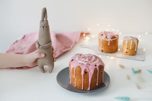 Easter cake, colorful eggs and rabbit toy. Happy Easter holiday concept. festive spring season.