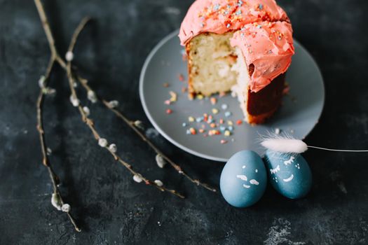Easter cake, colorful eggs and willow branches. Happy Easter holiday concept. festive spring season.
