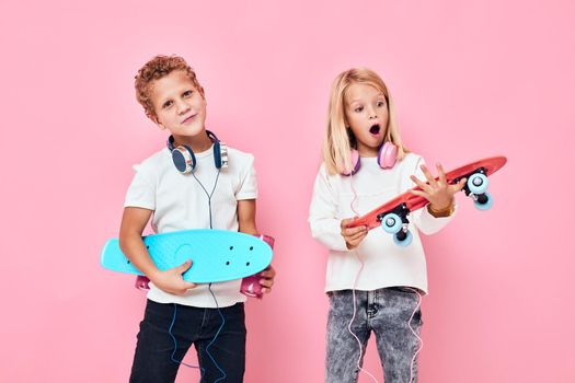 Active young people stand next to skateboards active lifestyle childhood. High quality photo