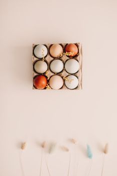 Chicken eggs of natural shades and colors on a white background. Healthy organic food, natural farmer's products concept. Happy Easter background. Selective focus. 