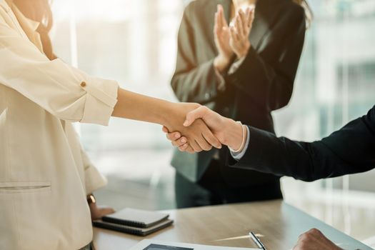 Partnership. asian business people shaking hand after business job interview in meeting room at office, congratulation, investor, success, interview, partnership, teamwork, financial, connection concept.