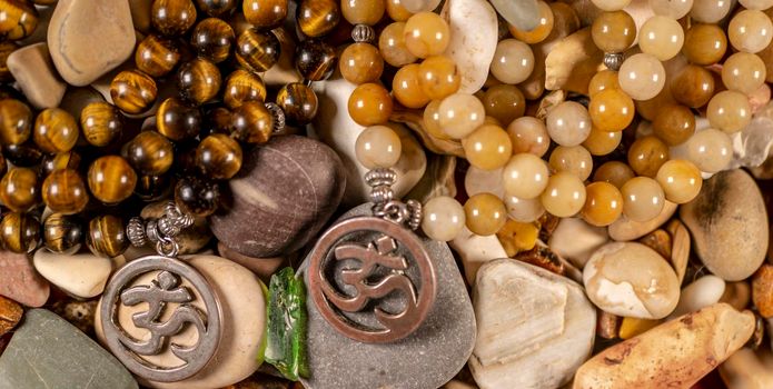 Buddhist prayer beads Mala lying on the sea rocks. the view from the top. the General plan
