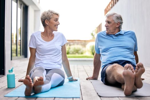 Shot of a mature couple taking a break while exercising outdoors.