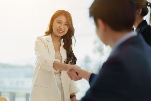 Partnership. asian business people shaking hand after business job interview in meeting room at office, congratulation, investor, success, interview, partnership, teamwork, financial, connection concept.