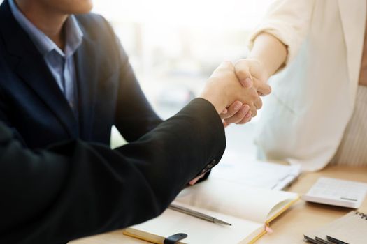 Business asian people shaking hands, finishing up meeting, business etiquette, congratulation, merger and acquisition concept.