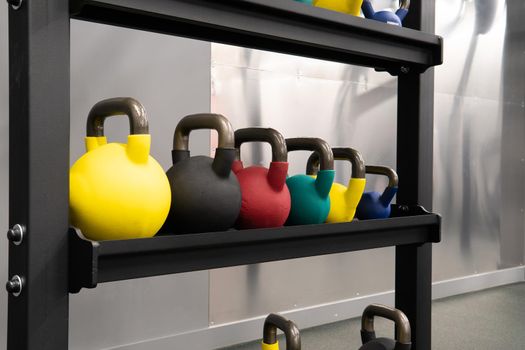 Yellow kettlebell weight healthy exercise, for fitness fit from lifestyle from muscle activity, assorted colours. Pace pound fitness, ball dumbbell black fresh black background object