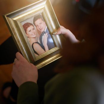 High angle shot of someone holding a wedding photo.