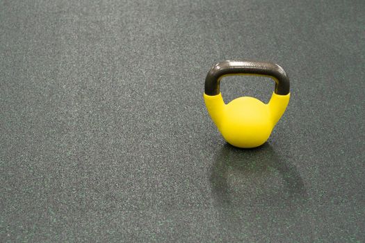 Yellow kettlebell weight healthy concept, from fitness fit in lifestyle from muscle steel, shape raining. Wellness active club, physical dumbbell black fresh black background object