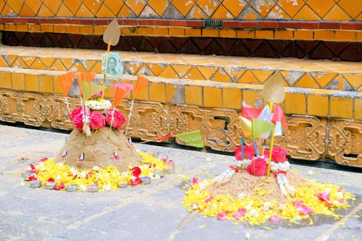 Group of sand pagoda on temple in Songkran Festival, Sand Pagoda is an ancient tradition of the ancient people. And these sand pagodas are also decorated with flags and flowers