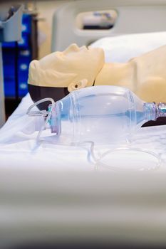 Image of CPR dummy with defibrillator