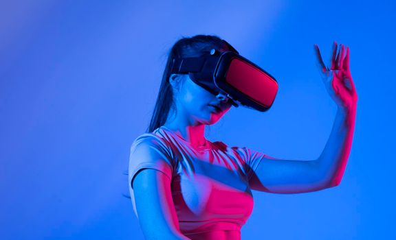 Woman architect using vr glasses for construction design. Engineer with headset working with virtual reality to design building model and maquette. Architectural work project