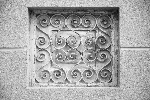 Old rusty metal grate in old building in Spain