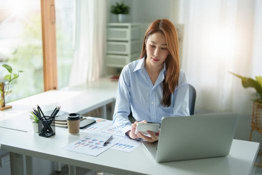 accountant, Auditor, Self-Employed, Finance and Investment, Marketing and Accounting, Portrait of Asian female entrepreneur using a calculator to calculate. Company business results document