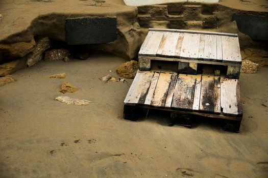 Wooden staircase to access the beach broken by the storm