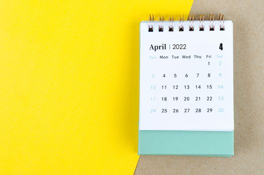 The April 2022 desk calendar on beautiful background.
