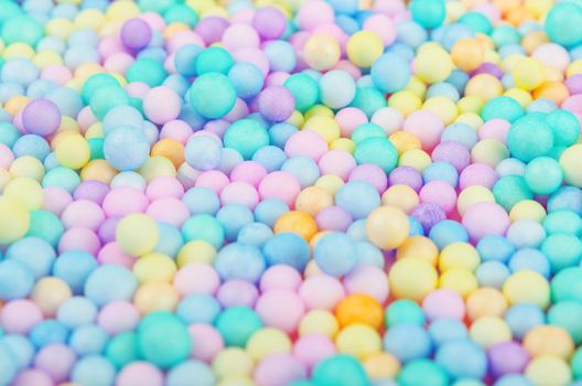 The Foam beads of various colors brightly colored abstract background.