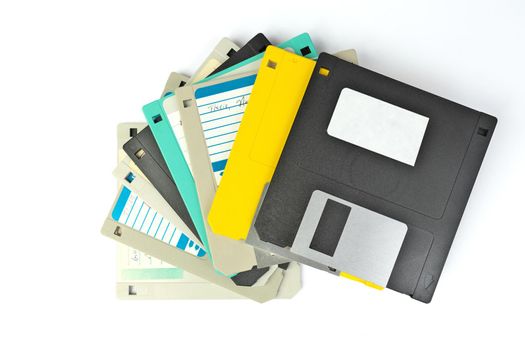 Directly Above Pile of 3.5 Inch Floppy disks for background Isolated on a white background. Retro digital storage technology.