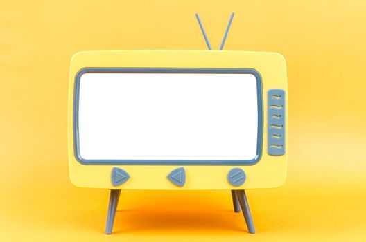 The Vintage Miniature Toy Television on yellow background.