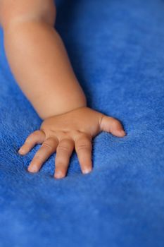 Child's hand on a blue veil,full hd video