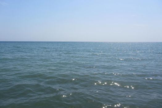 On image: The view from the front in the morning sky is bright blue with clear white clouds. And the ocean depths of indigo in the daylight. A feeling of calm, cool, relaxing.