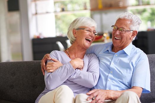 Shot of a senior couple enjoying each others company at home.