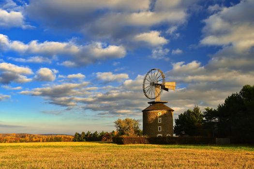 Beautiful old windmill at sunset. Ruprechtov - Czech Republic.