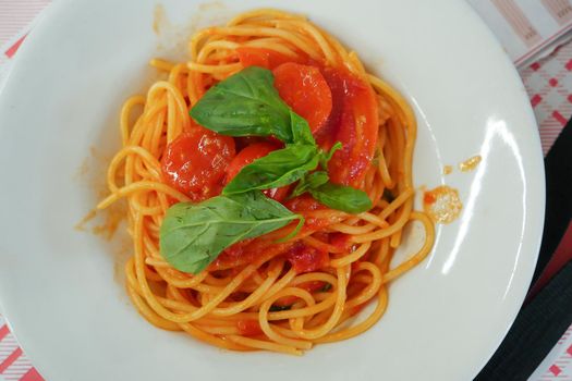 Italy, Campania, Naples, Restaurant, plate of pasta with tomato sauce , High quality photo