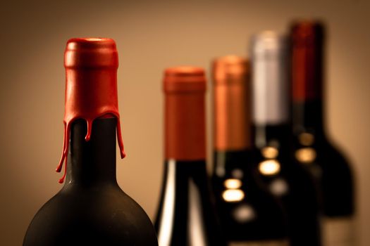 Set of collars red wine bottles isolated on black background, France
