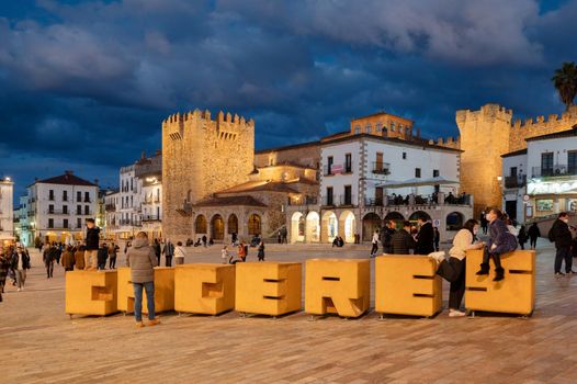 Caceres, Spain - March 5, 2022: Tourist visiting the main square in the old town of Caceres .