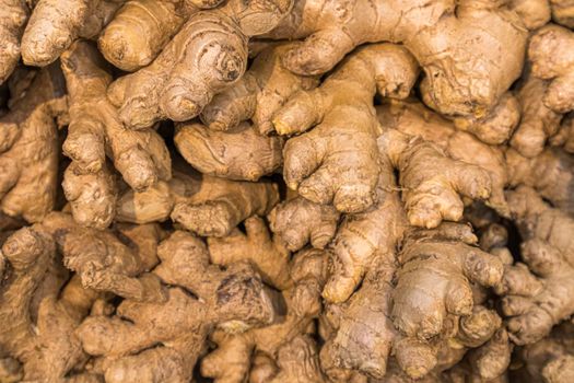 ginger root on the shelves in close-up as a background. photo