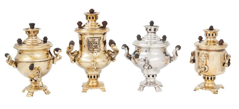 Row of four 2 inch souvenir samovars.