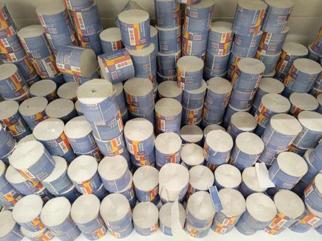 full frame view on large stacks of cheapest russian rough toilet paper rolls on shelf of grocery store in Tula. Russia - March 3, 2022