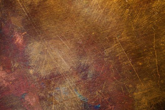 Orange-yellow copper surface flat close-up texture an full frame macro background